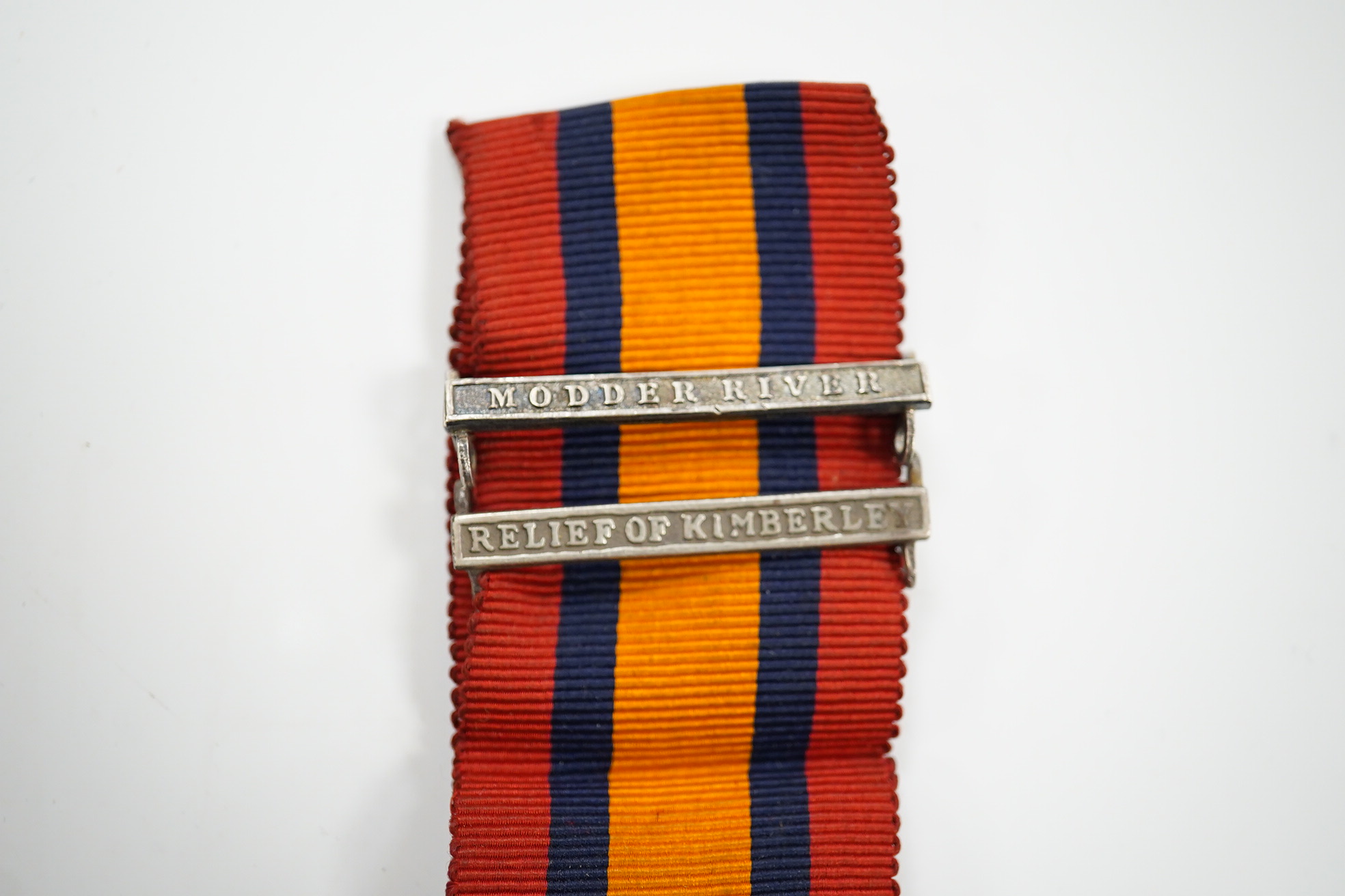 A Queen's South Africa Medal with Relief of Kimberley and Modder River clasps to 324 Pte. J.Aitken, ARG: & SUTH: HIGHRS